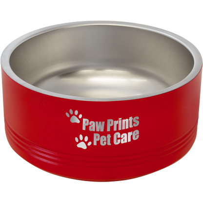 a red dog bowl with paw prints on it